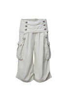 Victory jorts in beige from the Double Punch SS26 'Illusory Victory' collection. Flipped waistband design. Napoleon military jacket inspired double-breasted decorative buttons. Large side pockets. Baggy cargo shorts silhouette. Soft, comfortable 100% cotton fabric.