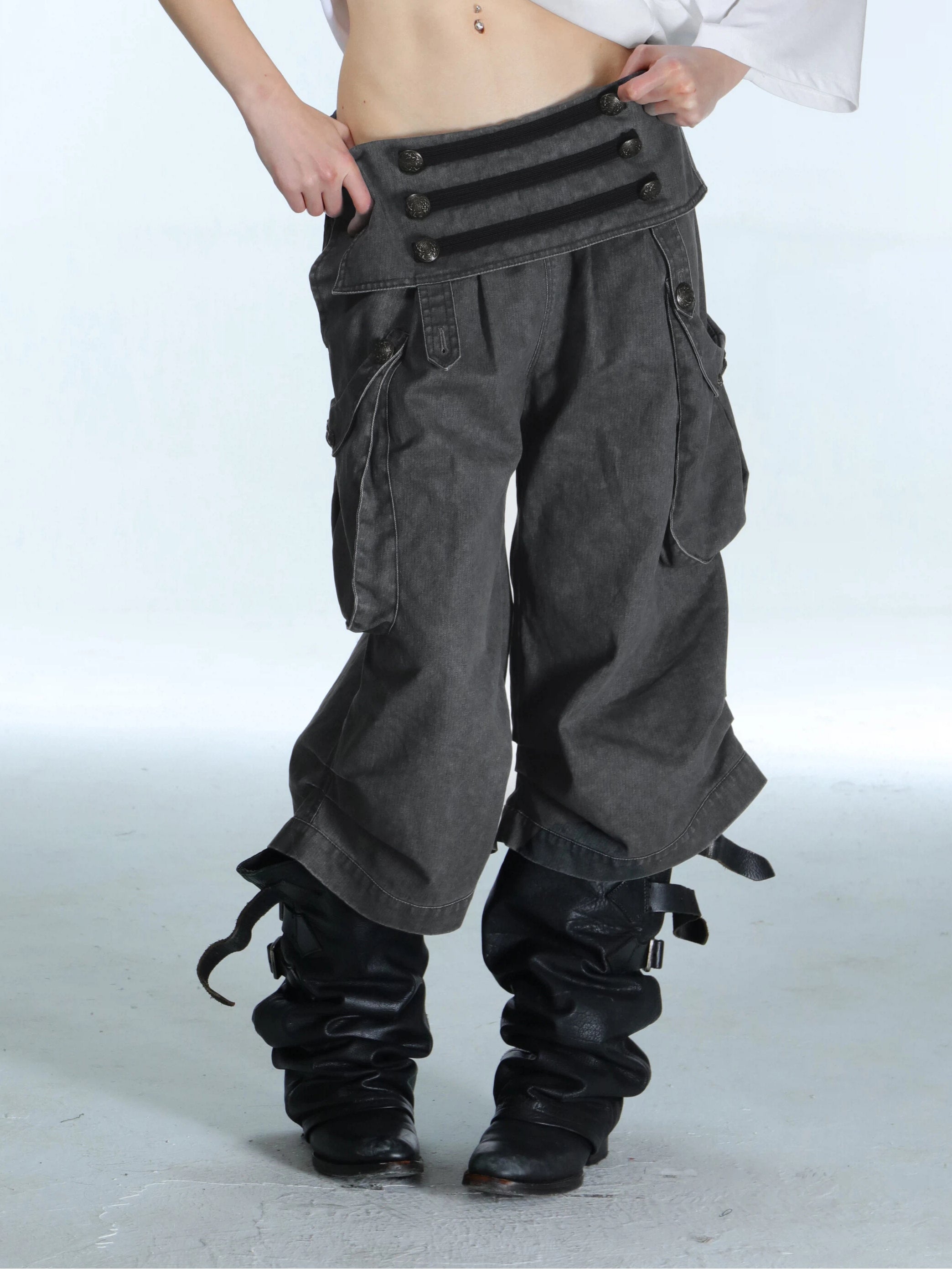 Victory jorts in grey from the Double Punch SS26 'Illusory Victory' collection. Flipped waistband design. Napoleon military jacket inspired double-breasted decorative buttons. Large side pockets. Baggy cargo shorts silhouette. Soft, comfortable 100% cotton fabric.